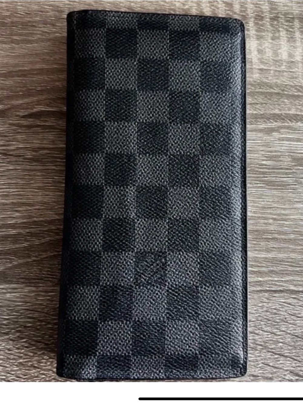 Louis Vuitton wallet with card holders and coin holder.